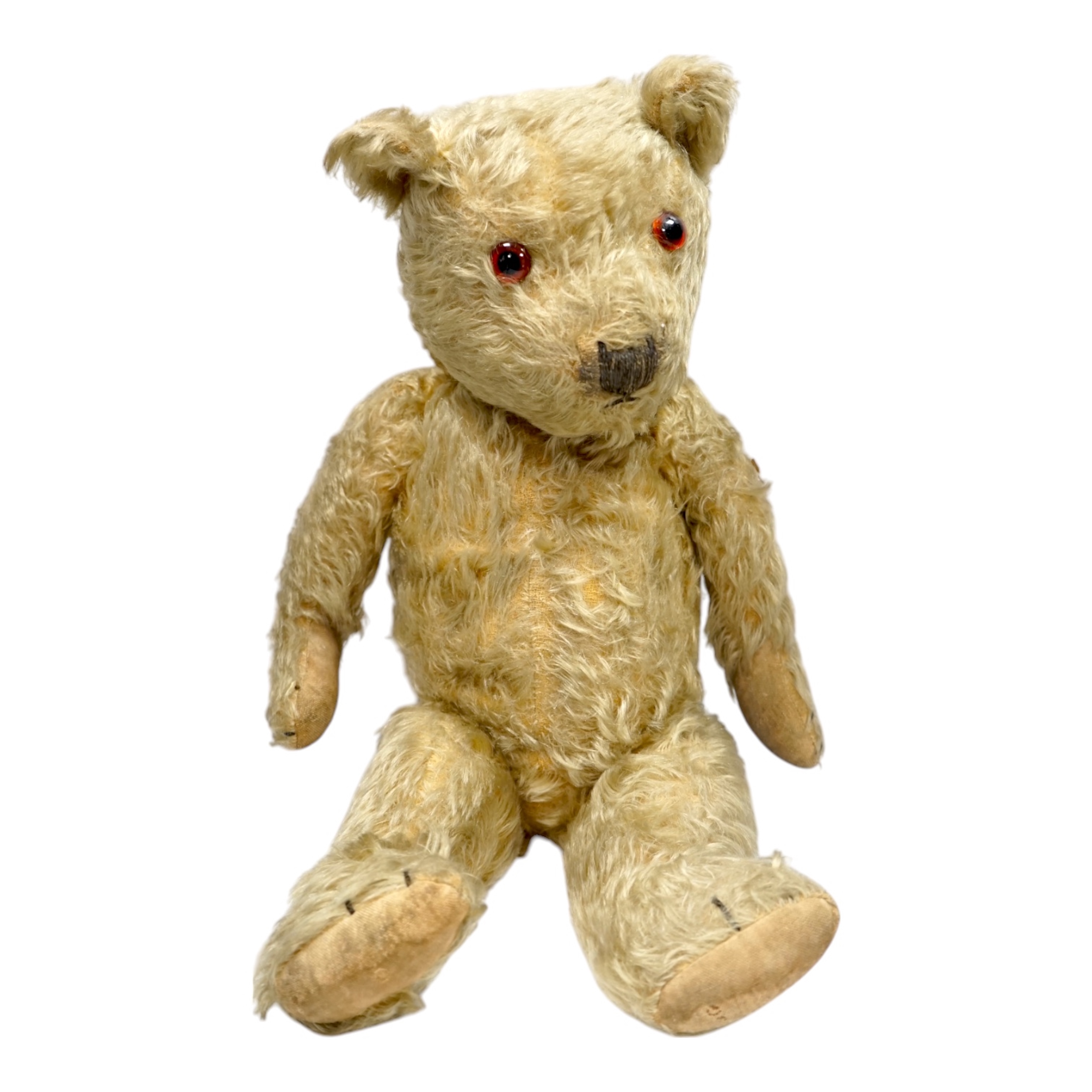 A 1930’s English Teddy bear, gold mohair plush and glass eyes, 49cm. Condition - fair